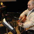 Larry Muller, of Lowell, plays the guitar Dec. 12 at the Cross Church Marshallese service in Springd...