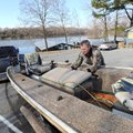 Les Hale pulls the plugs on the livewells in his jon boat after removing it Thursday from Lake Sequo...