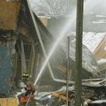Firefighters respond after an explosion and collapse at the William C. Franks furniture store in Way...