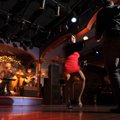 Patrons dance to the music of the band Neta on Dec. 4 at Scarpino’s on West Avenue in Fayetteville.