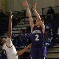 Fayetteville sophomore Cameron Paschke, right, shoots over Searcy sophomore Antwan Arnold in the fir...