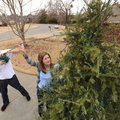 HOLIDAY AFTERMATH Jeff and Shelly Fletcher remove lights from their Christmas tree Thursday at their...