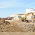 Workers operate heavy machinery while excavating on Dec. 22 to make room for expansion at Fayettevil...