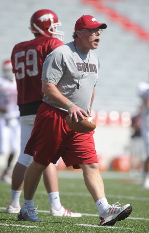 Arkansas defensive coordinator Willy Robinson directs a drill during spring practice on April 14 in Reynolds Razorback Stadium in Fayetteville.