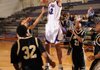 Fayetteville junior Derek Arnold takes a shot over Little Rock Central on Nov. 27 in Bulldog Gymnasium at Fayetteville.