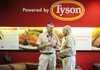 Tyson Foods CEO Donnie Smith, left, speaks with Don Tyson at the Tyson Corporate office in Springdale in 2010.