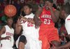 Jacksonville’s Xavier Huskey (left) and Little Rock Hall’s Myles Taylor collide as they both try for a rebound during the Warriors’ 45-43 victory over the Red Devils on Friday in Jacksonville. 
