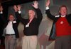 University of Arkansas Athletic Director Jeff Long, from left, UA System President B. Alan Sugg and UA Chancellor Dave Gearhart call the Hogs at the chancellor’s reception Monday evening in New Orleans preceding the Sugar Bowl. A variety of activities led up to the big game on Tuesday.
