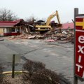 Construction workers demolish the McDonalds restaurant at 1641 N. College Avenue Wednesday, Jan. 19,...
