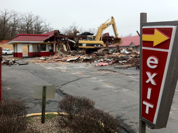 Construction workers demolish the McDonalds ...