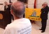 George Benham (foreground) listens during a Tea Party news conference Tuesday at the state Capitol as Todd Sharp of Little Rock (at lectern) says legislators will be watched and graded on how they vote. 