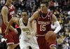 Arkansas guard Rotnei Clarke (15) drives past Vanderbilt guard John Jenkins (23) during the first half of Saturday’s game in Nashville, Tenn.