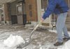 SHOVEL, THROW, REPEAT Kevin Lancaster, manager at the Rogers Little Theater at 116 S. Second St., shovels during another round of snow of Friday afternoon. He cleared the walk in front of the theater to prepare for shows this weekend. More photos of the winter storm are on the <a href="http://photos.nwaonline.com/">Northwest Arkansas Photo Blog</a>.

