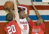 Little Rock Parkview’s Aaron Ross (32) looks to pass out of a double team set by Jacksonville’s Dustin House (20) and Raheem Appleby during the second quarter of the Patriots’ 61-51 victory over the Red Devils on Tuesday in Little Rock. 