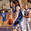Rogers High guard Cameron Carroll, center, reaches to score past Fayetteville sophomore Tyler McCull...