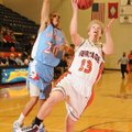 Rogers Heritage guard Garrett Macy shoots while guarded by Fort Smith Southside’s Daren Harris on Tu...