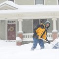 David Mervis shovels snow from the sidewalk Wednesday, Feb. 9, 2011, in front of his North Washingto...