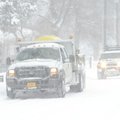 A City of Fayetteville Transportation Division truck spreads brine Wednesday, Feb. 9, 2011, along La...