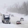 Traffic passed a stalled tractor trailer Wednesday heading North along Thompson Street in Springdale...