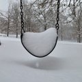 Snow covers the playground equipment at Happy Hollow Elementary School in Fayetteville Wednesday mor...
