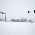 Snow blanketed an intersection near Tyson Foods Inc. headquarters in Springdale Wednesday morning.