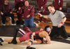 John Pearson of Bentonville, right, counts as Springdale High junior Jonathan Chan, left, pins Gentry junior Tyler Easter in a 119-pound division match on Feb. 12 during a tournament at Fayetteville High School.