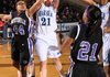 Fayetteville sophomore Turquoise Early, left, battles Springdale Har-Ber senior Maggie Gartner, center, and junior Summer Morgan, right, for a rebound during the first half Jan. 25 in Wildcat Arena in Springdale.