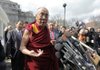 The Dalai Lama is swarmed by a crowd of reporters in this Associated Press file photo. The Dalai Lama will appear in Fayetteville on May 11.