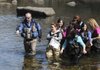  Jeff Belk, left, Rogers High School outdoor education teacher, takes water quality samples Wednesday and searches for water-based life forms in Beaver Lake with his students. The Beaver Water District has spent about $220,000 on kindergarten through 12th-grade educational programs over the past seven years, said Amy Wilson, the district’s director of public affairs.
