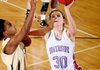 Fort Smith Southside’s Emilie Gray goes up for a shot Wednesday against Little Rock Central’s Jamie Ruffins during the first half of the Rebels’ 54-42 victory over the Tigers at the Class 7A state tournament in Rogers. Gray finished with a career-high 33 points.