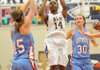 North Little Rock’s Kayla Brown (center) pulls up for a jumper over Fort Smith Southside defenders Kacy Kimbrough and Emilie Gray during the Class 7A state tournament in Rogers. 