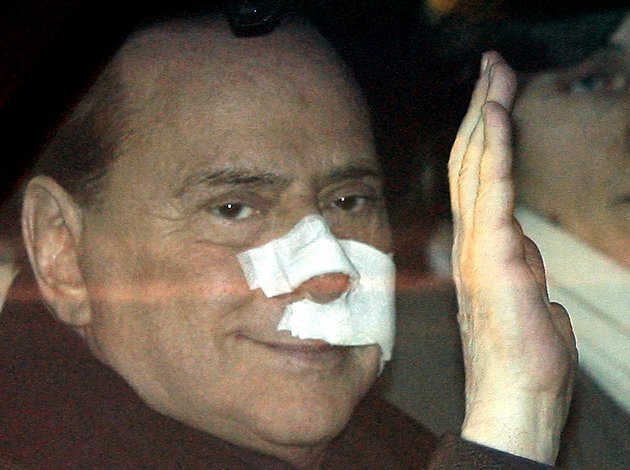 this-dec-17-2009-file-photo-shows-italian-premier-silvio-berlusconi-waving-from-his-car-as-he-arrives-at-his-home-in-arcore-italy-after-being-attacked-by-a-mentally-ill-man-at-a-political-rally