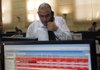  A trader works Wednesday during the first session in nearly two months at Egypt’s stock exchange in Cairo. 