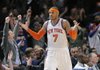 New York Knicks' Carmelo Anthony reacts as the fans cheer after he hit a shot during the fourth quarter of an NBA basketball game against the Orlando Magic Monday, March 28, 2011 at Madison Square Garden in New York.  Anthony led all scorers with 39 points as the Knicks won 113-106 in overtime. 