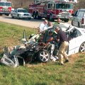 FATAL WRECK Emergency personnel look over a Hyundai Sonata involved in an accident Saturday on Inter...