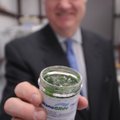 Jim Phillips, president and CEO of Nanomech, holds a bottle of nano grease on Tuesday.