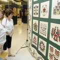 BEST OF SHOW Dolly Cowan, left, and Cecilia Feroe, both of Harrison, look over Nancy Gruenewald’s qu...