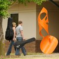 A sculpture by artist Nic Noblique graces the entrance to White Auditorium at NorthWest Arkansas Com...