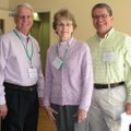 Bob Norwood, from left, joins Lynne Walton and Galen Havner at the conclusion of an inaugural staff-...