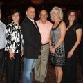 Monsignor David LeSieur, from right, and St. Vincent de Paul School board members Karen Peters, Laur...