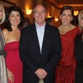 St. Vincent de Paul School principal Joe Sines, center, and Tapas and Tinis committee members Celia ...