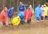 Ozark Natural Science Center teacher naturalist Rob Seal, center, leads Holt Middle School students on March 31 in an exploration of the observation pond.
