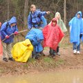 Ozark Natural Science Center teacher naturalist Rob Seal, center, leads Holt Middle School students ...