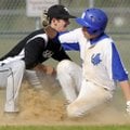 Rogers High’s Payton Jimison, right, beats the tag by Tulsa (Okla.) Bishop Kelley’s Jack Fischer at ...