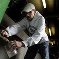 Water operator James Erskin takes a sample from a clarifying tank Thursday while performing an hourl...