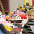 BOOSTER SALE Daylon Goodine, 2, looks at several toys on display Friday during the Springdale High S...