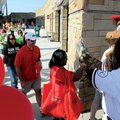 HEARTFELT ENCOURAGEMENT Strike the Sasquatch, Northwest Arkansas Naturals mascot, encourages walkers...