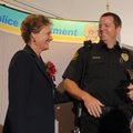 Officer Gene Johnson, right, with the Springdale Police Department, chats with Chief Kathy O’Kelley ...
