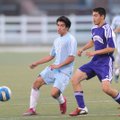 Springdale Har-Ber’s Eric Landeros, left, sends the ball past Fayetteville’s Tyler Ho during the fir...