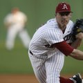 Arkansas pitcher Brandon Moore delivers a pitch Saturday night against LSU. A Baum Stadium record cr...